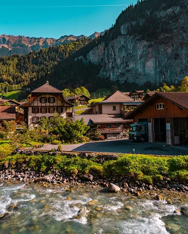 A serene river winding through a lush mountain valley,