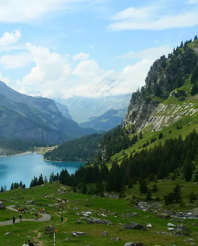 A vast expanse of water reflecting the sky, surrounded by distant landforms